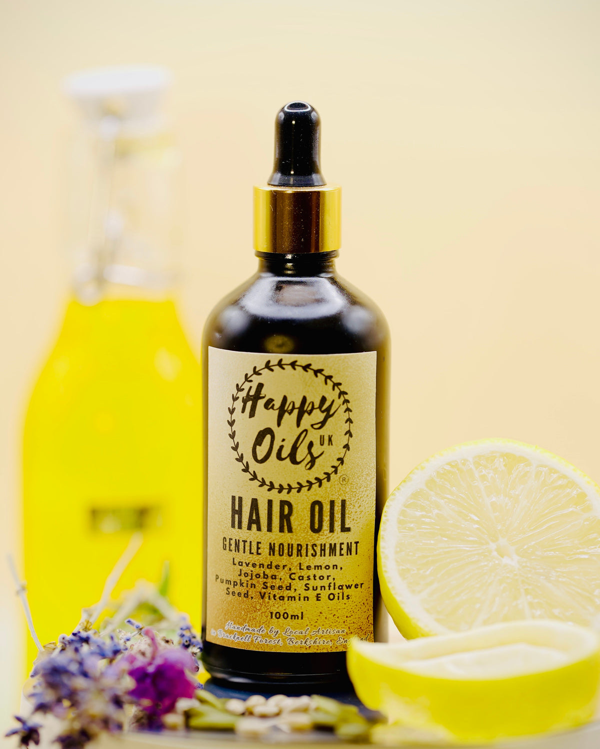 Hair oil gentle nourishment 100ml bottle with lemon and flowers on a light background. 

Hair Oil ingredients: Lemon, Lavender, Jojoba, Castor, pumpkin Seed, and Vitamin E Oils.
